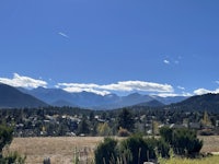 a view of a town with mountains in the background