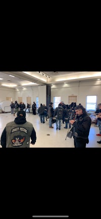 a group of people are standing in a room
