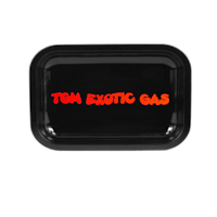 a black tray with the word exotic gas on it