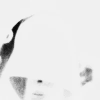 a black and white photo of a person with a hat on