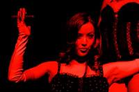 a woman is holding a cigarette