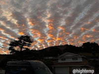 a van parked in front of a house at sunset