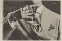 a man in a suit is holding a cup of coffee