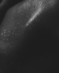 a black and white photo of a woman's body