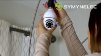 a woman is using a vacuum to clean her bathroom