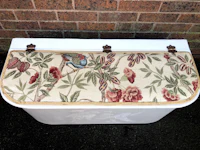 a laundry basket with a floral pattern on it