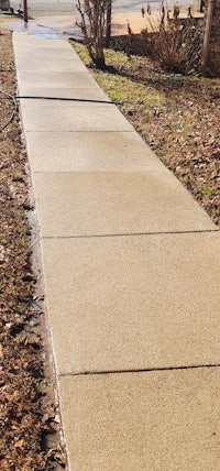 a sidewalk that has been paved with concrete