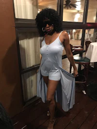 a woman in a blue dress posing for a picture