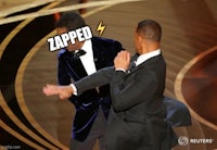 a man in a tuxedo is dancing on stage at the oscars