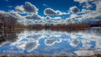 clouds are reflected in the water