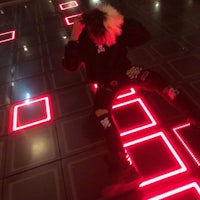 a person laying on the floor with red squares