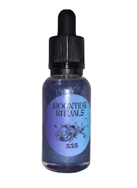 a bottle of blue and purple liquid with the words'moon's rites' written on it