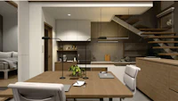 the interior of a small house with stairs and a desk