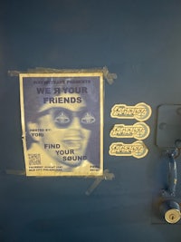 a poster on a blue door that says we're your friends