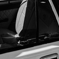 a black and white photo of a car door