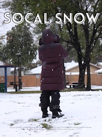 a child is standing in the snow with the words social snow