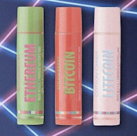 three lip balms on a blue background