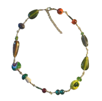 a necklace with colorful glass beads on a black background