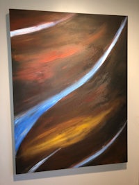 an abstract painting with blue and brown colors