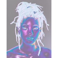a photo of a woman with dreadlocks and purple hair