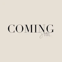 the word coming soon on a beige background
