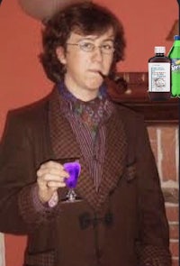 a man in a suit holding a purple drink