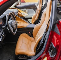 the interior of a red sports car