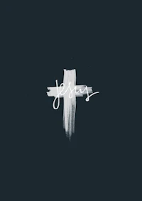the word jesus is painted on a dark background