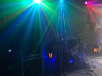 a stage with colorful lights and a drum set