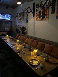a long table is set up in a dining room