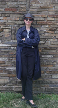 a woman wearing a hat and a coat