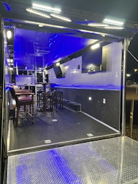 the inside of a trailer with blue lights