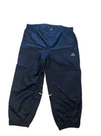a pair of blue jogging pants on a black background