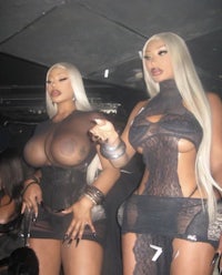 two women in lingerie standing next to each other