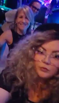 a group of people taking a selfie at a party