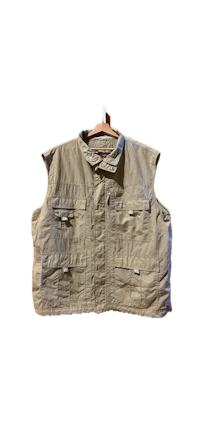 a tan vest hanging on a hanger