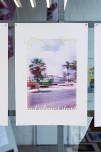 four polaroid prints hanging on a wall