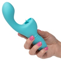 a woman's hand holding a blue vibrating toy