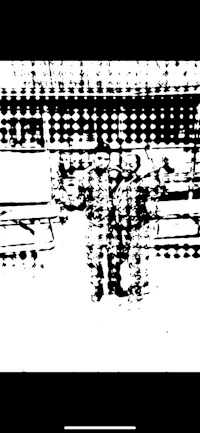 a black and white image of a train on a track