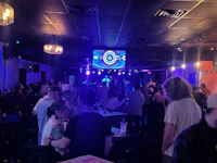 a crowd of people at a bar