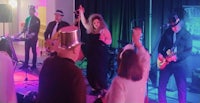 a group of people on stage at a party