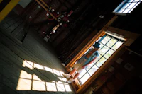 a person standing in a room with a window