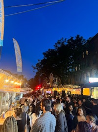 a crowd of people at a street fair