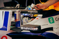 a man in a red bull racing car