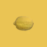 a lemon on a yellow background