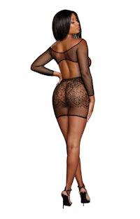 the back of a woman in a black mesh bodysuit