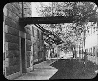 an old black and white photo of a walkway