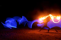a person is holding a fire wand