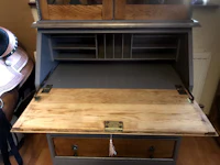 a desk with drawers and a wooden top