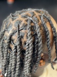 a woman's hair with dreadlocks in it